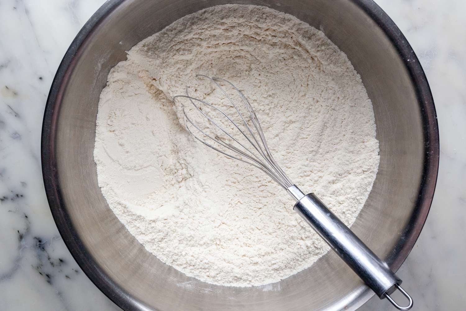 The dry ingredients for Irish Soda Bread in a mixing bowl