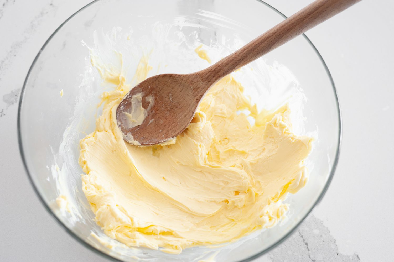 Bowl of Smooth Butter Beaten by a Wood Spoon for Shrimp Butter Recipe 