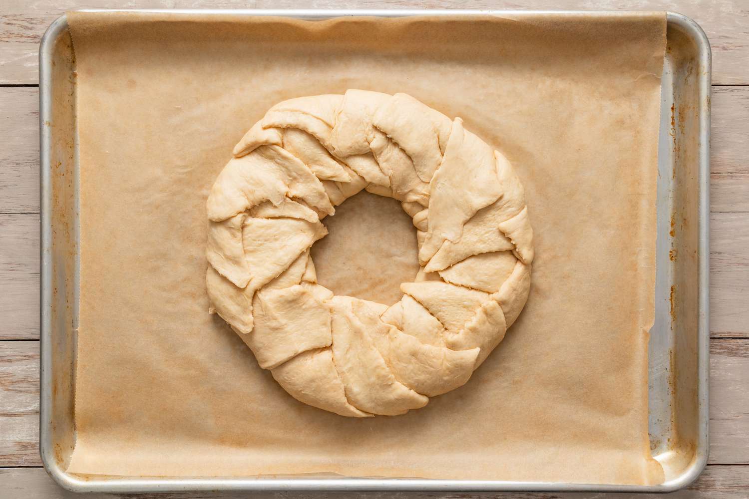 shape of the king cake after all edges are folded 
