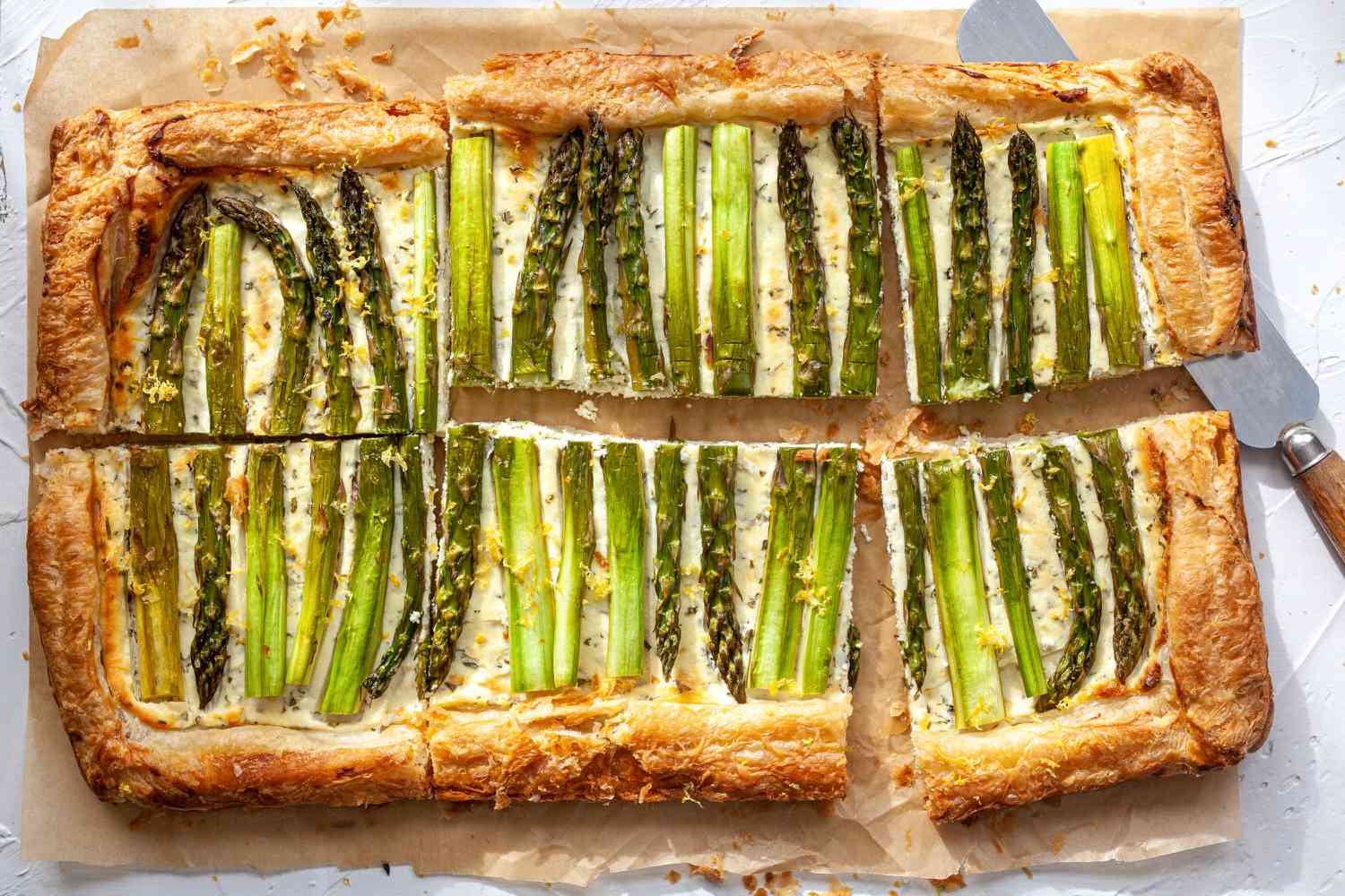 Asparagus Tart with Goat Cheese and Lemon cut into slices.
