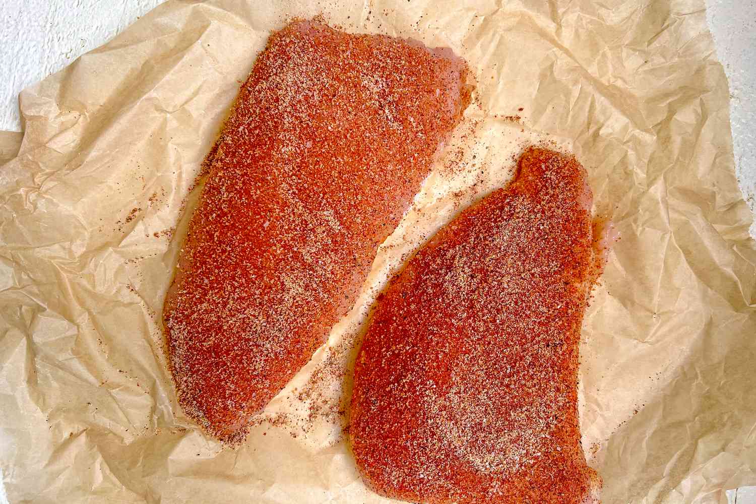 Turkey Tenderloin Seasoned with Spices on Parchment Paper