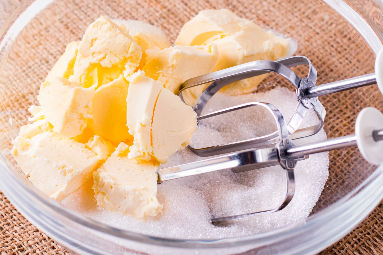 Butter and sugar in a bowl with a mixer