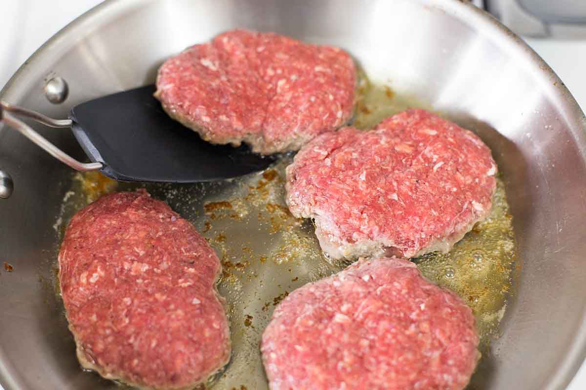 Sear the salisbury steaks in a pan