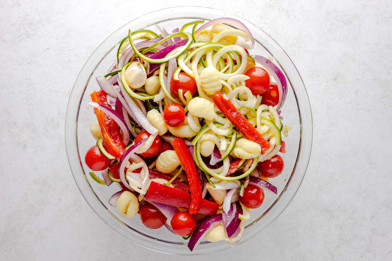 Seasoned Gnocchi, Zucchini, Tomatoes, and Bell Peppers in a Bowl