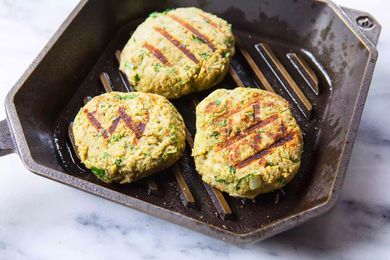Three patties in a grill pan to show tips to make a great veggie burger.