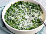 microwave creamed spinach in a white bowl