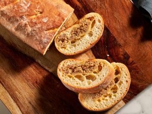 Sliced loaf of bread with a sausage filling