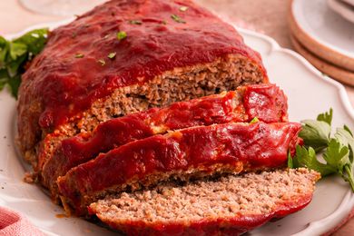 A sliced meatloaf on a platter