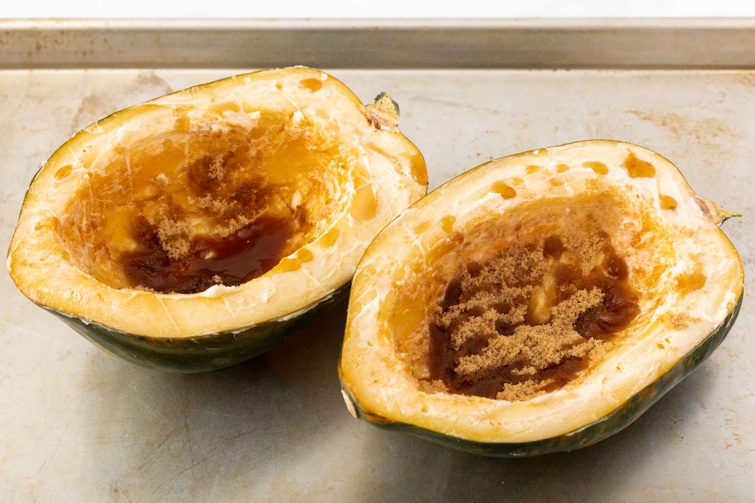 Brown sugar added to a squash to make baked acorn squash.
