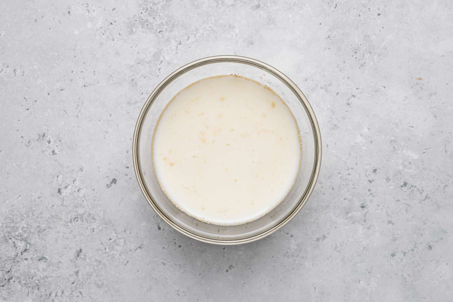 Bowl of Warm Milk and Yeast for Gooey Butter Cake Recipe