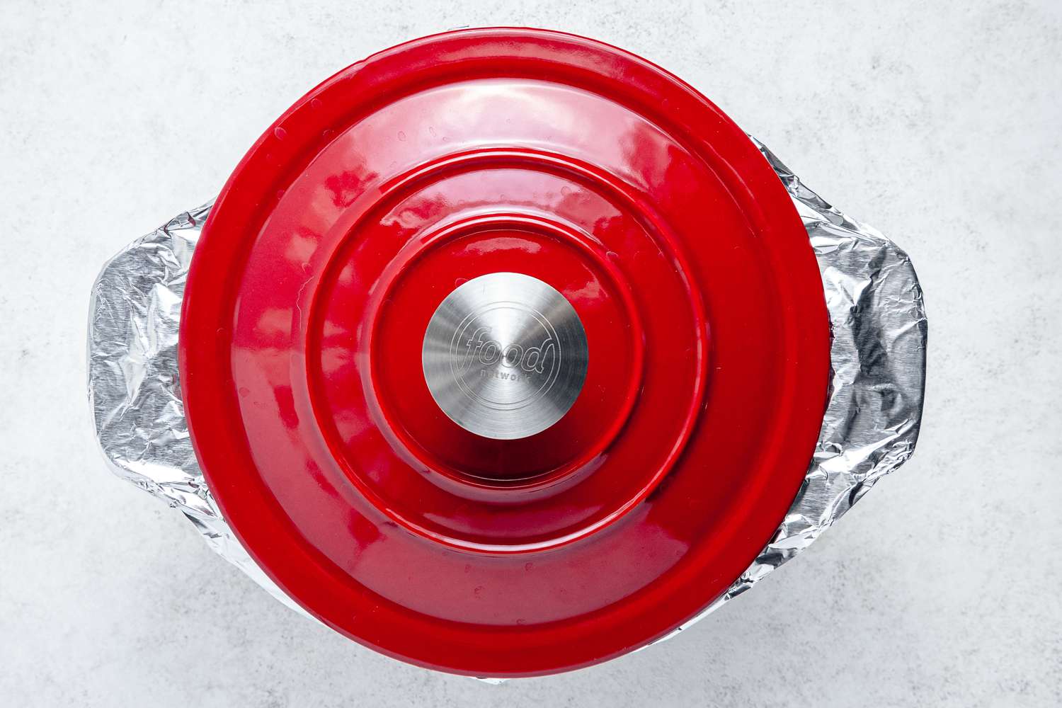 Dutch Oven Wrapped in Aluminum Foil and Topped With the Lid
