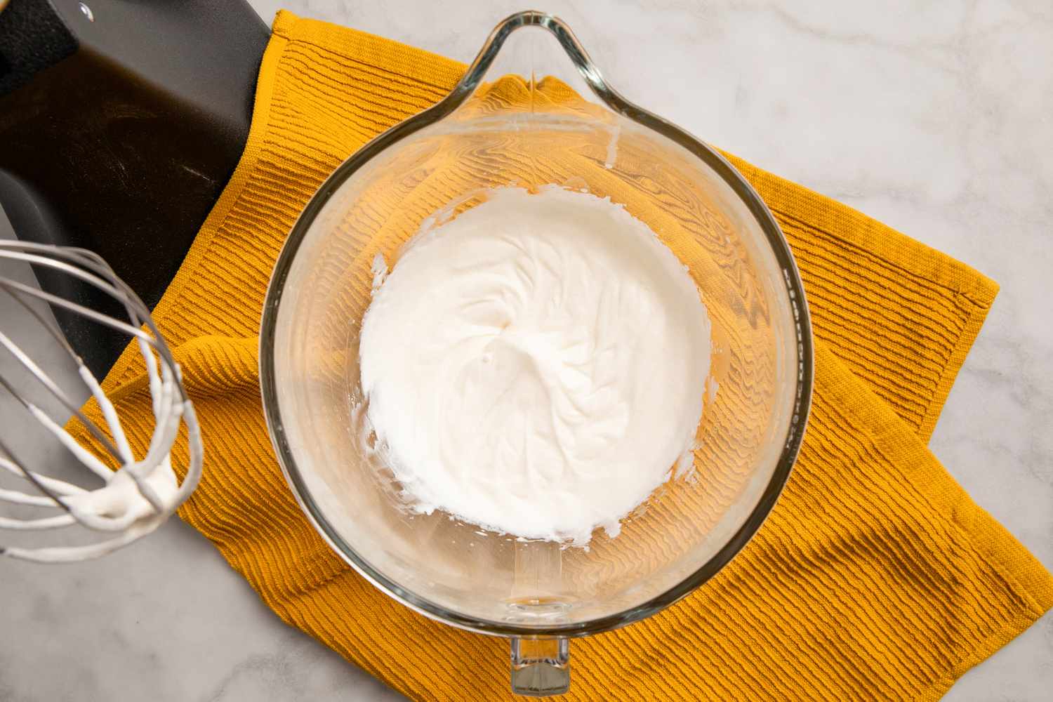 overhead view of cream that has been whipped in mixer bowl for Southern Banana Pudding