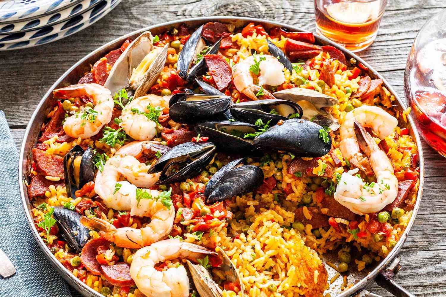 Finished seafood paella from the grill in a skillet ready to serve