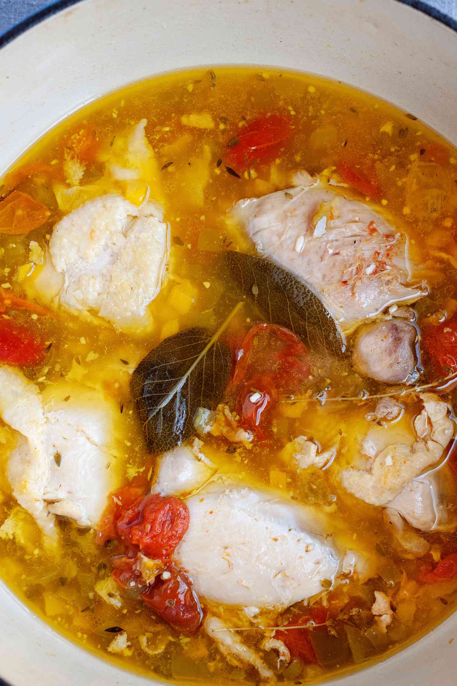 A pot of Stewed Chicken with Golden Tomatoes from New Native Kitchen