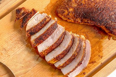 Turkey Tenderloin Sliced on a Cutting Board