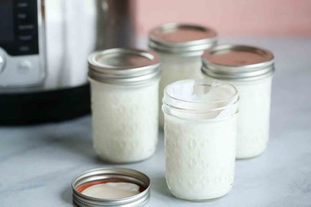 Homemade Yogurt resting in four jars