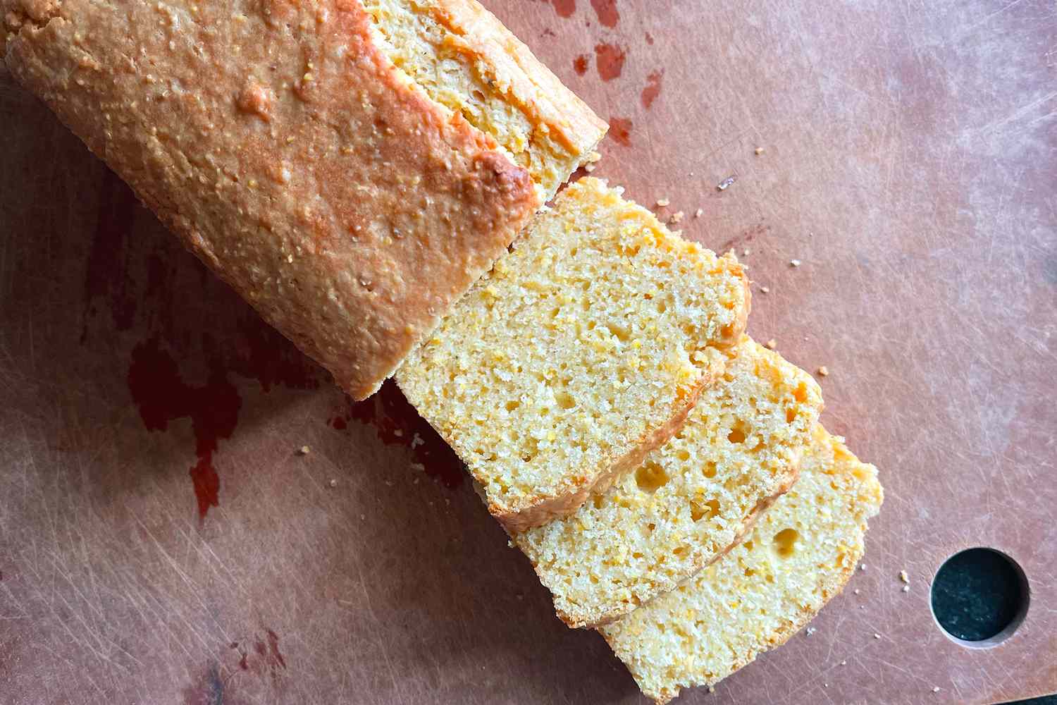 Slices of cornbread on a wooden surface