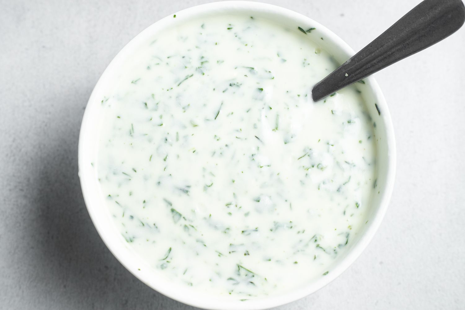 Bowl of Herbed Yogurt for Farro, Mushroom, and Egg Grain Bowl Recipe