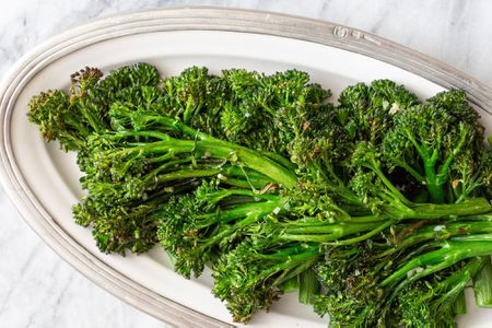 Broccolini roasted and set on a platter.