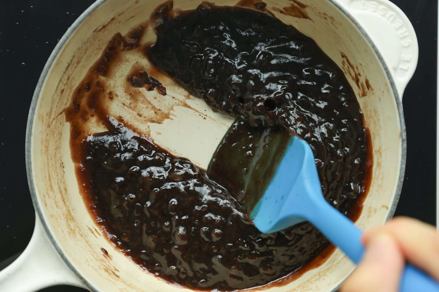 Red Beans Boiled Down and Squished Using a Spatula for Red Bean Tangyuan Recipe
