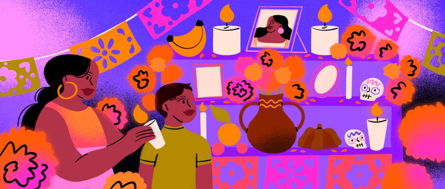 Dia de Muertos altar with a young boy and woman standing in front of it