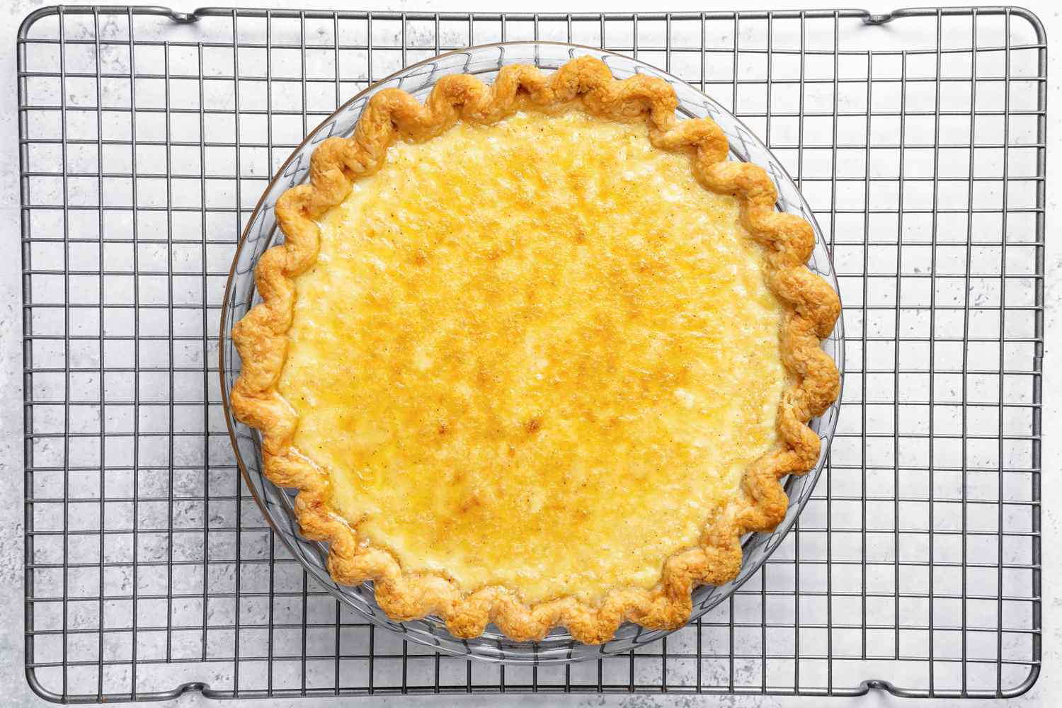 Baked Egg Custard Pie Cooling on Wire Rack