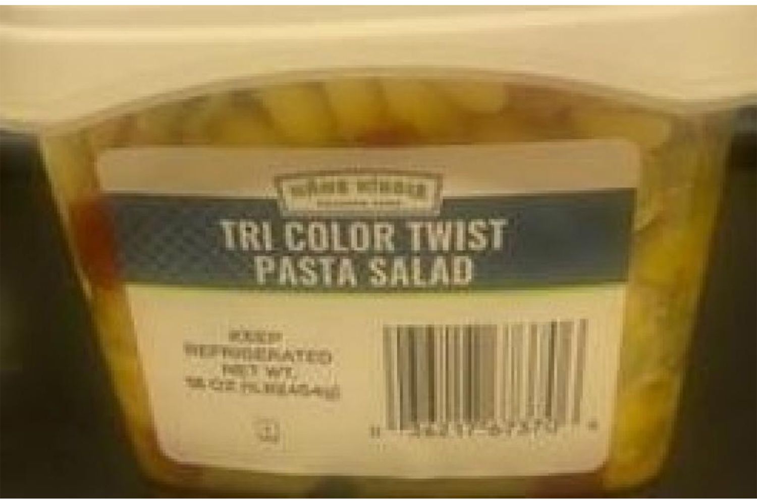 Tri Color Twist Pasta Salad in a plastic container with a label and barcode