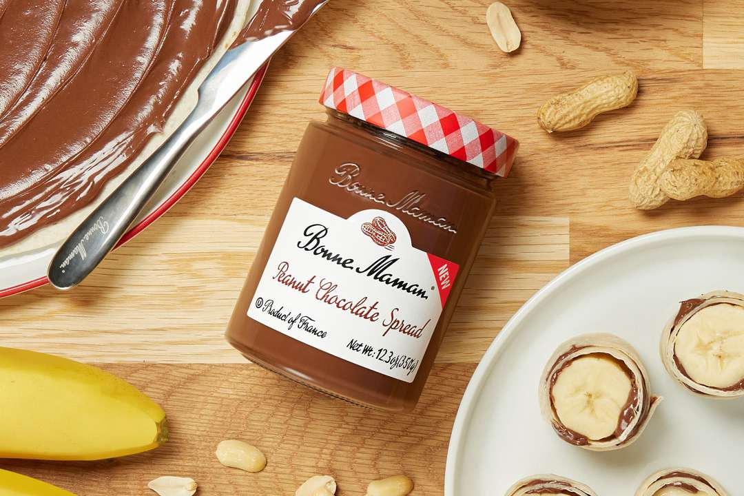 Bonne Maman Peanut Chocolate Spread jar on a wooden table