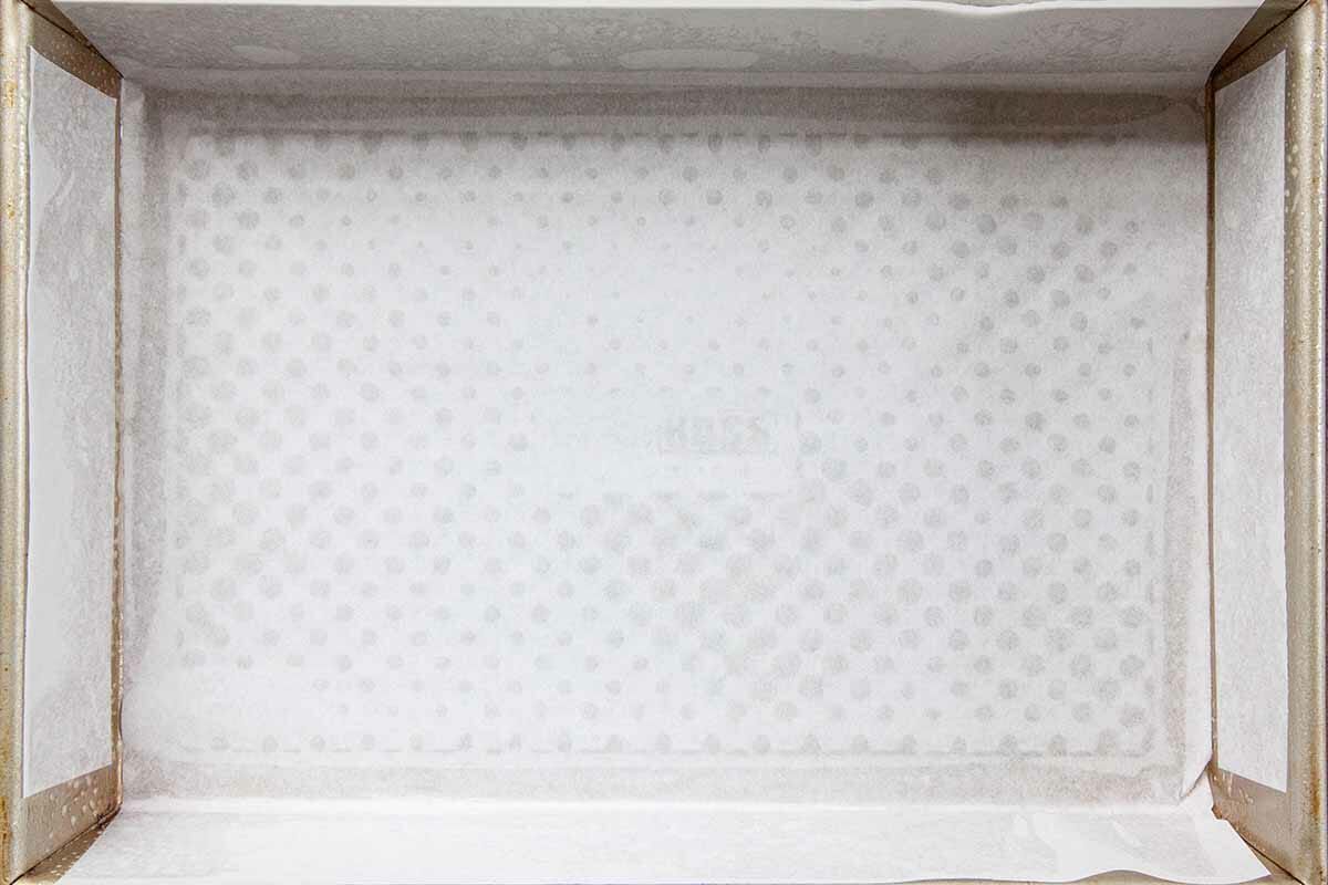 Crumble Bars with Rhubarb and Strawberry line the pan with parchment