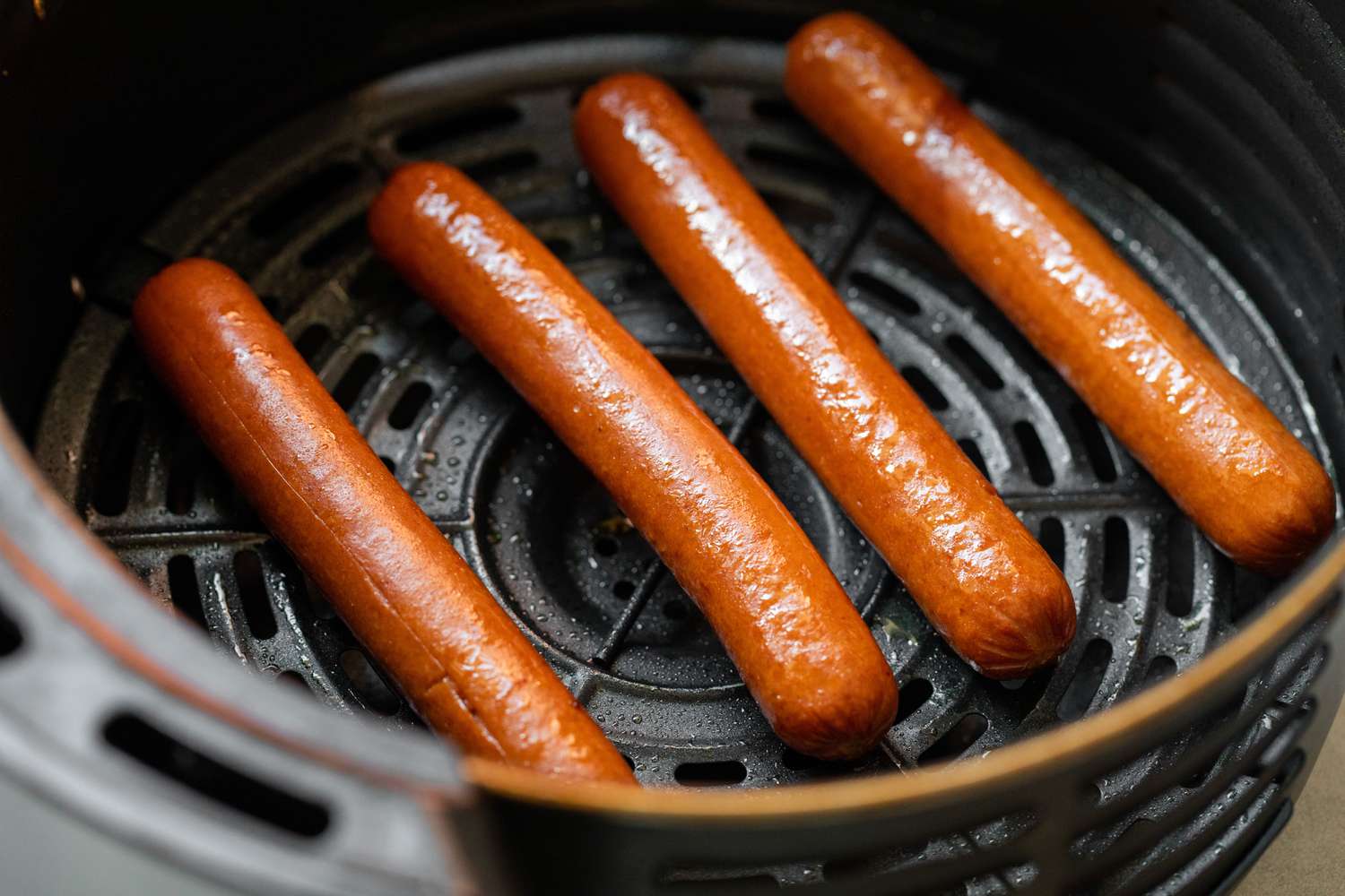 Air Fried Hot Dogs in Air Fryer Basin