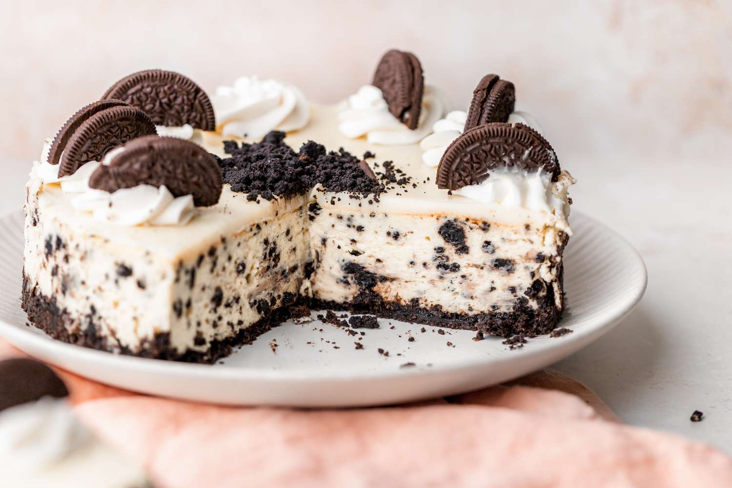 Cut Oreo cheesecake on a plate