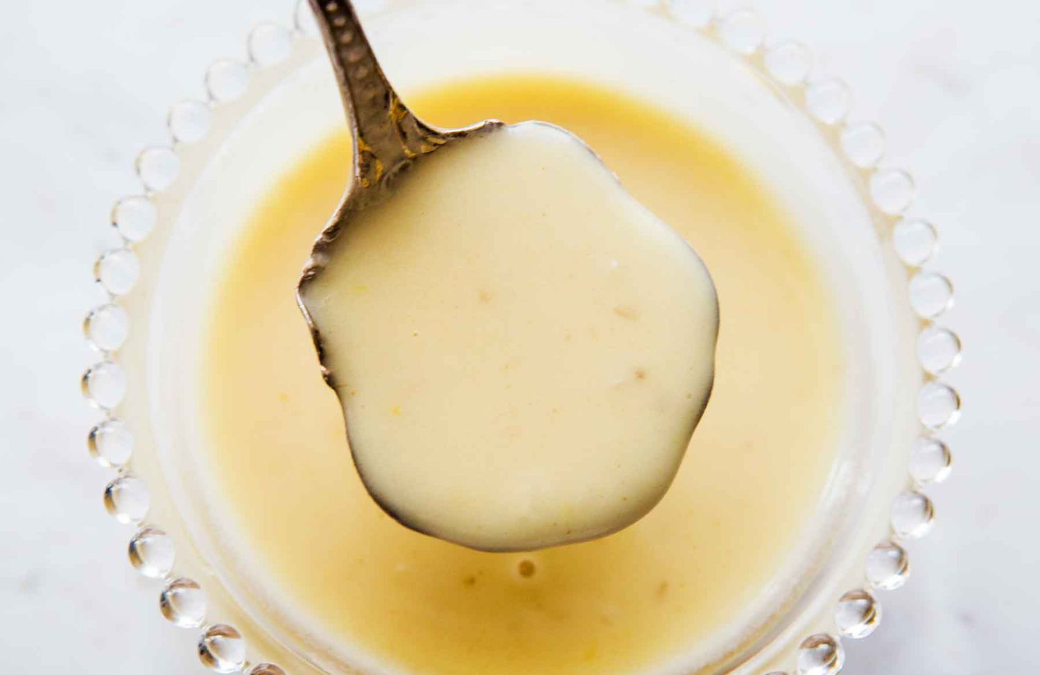 lemon butter sauce on a spoon