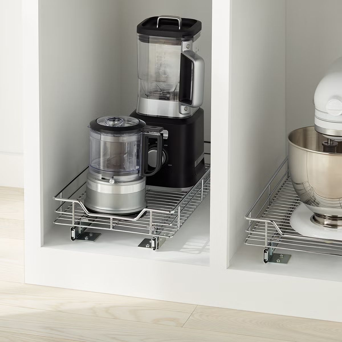 Drawer organizers storing kitchen appliances like blenders and mixers