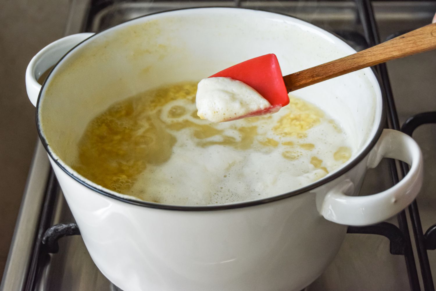 Foam from Boiling Lentils Removed Using a Spatula for Lentils and Spinach Curry 