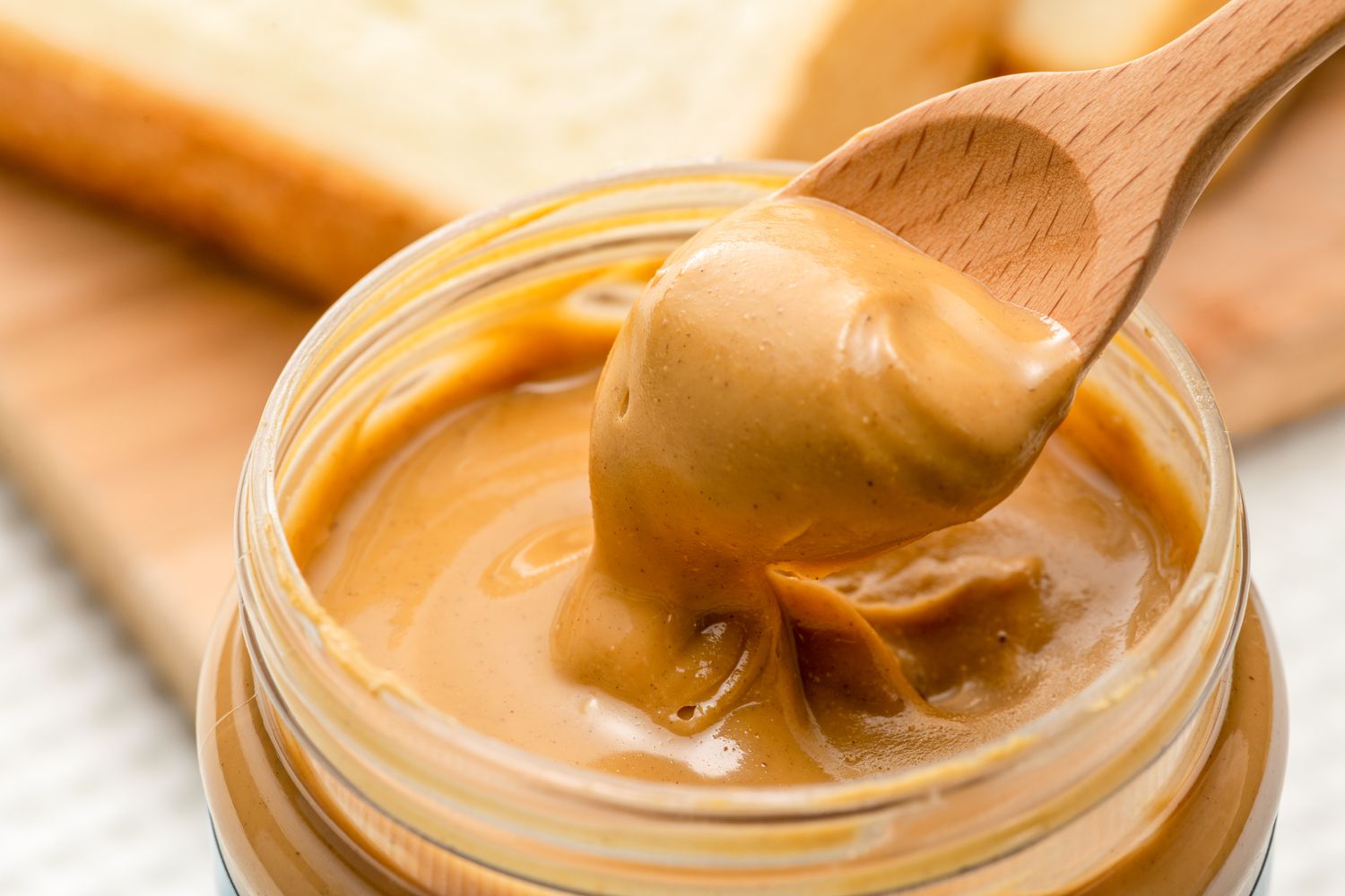 spoonful of peanut butter lifted from a jar