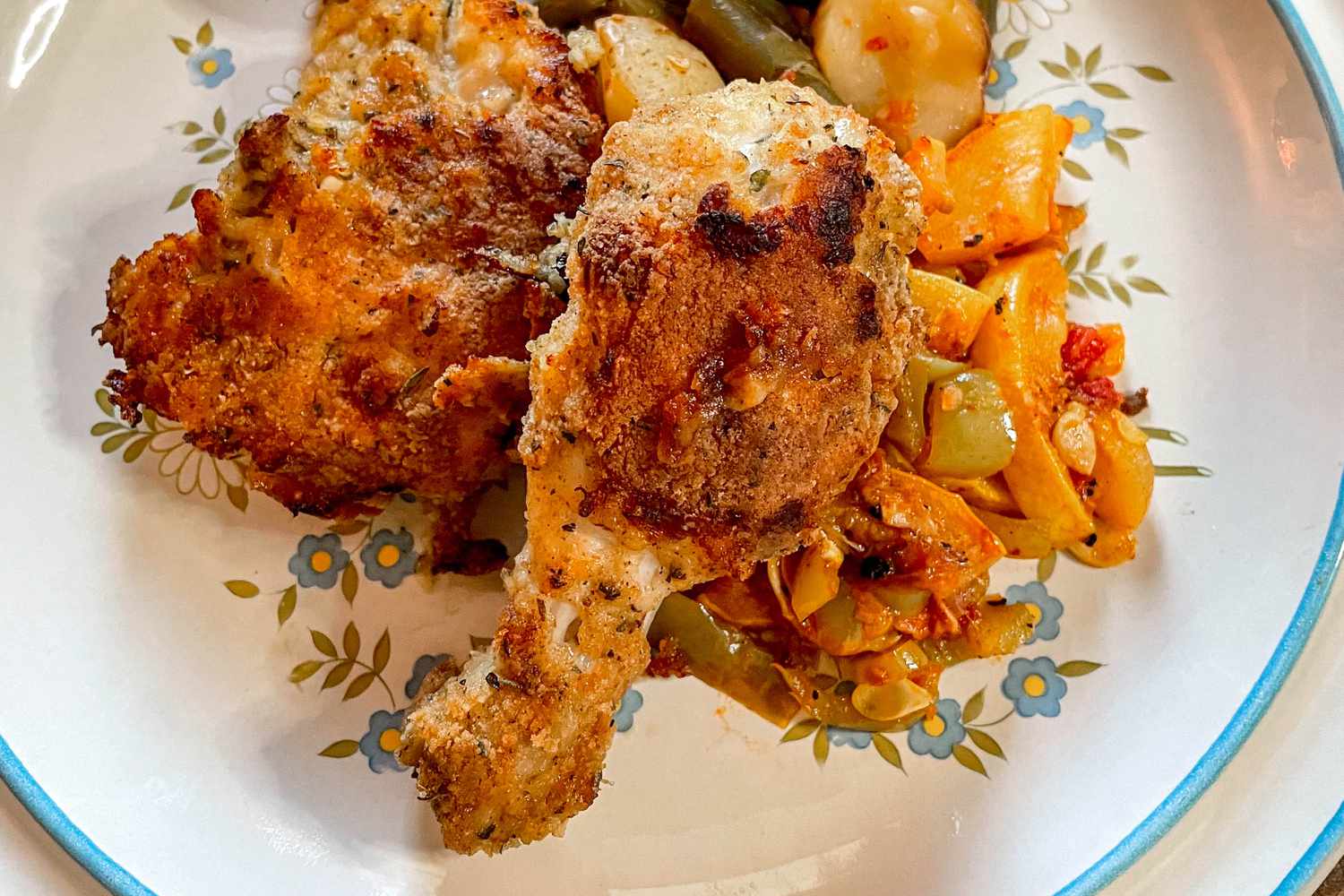 Plate of un-fried chicken served with vegetables (potatoes, green beans, and a squash stir-fry) 