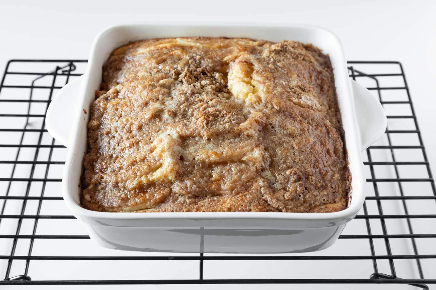 Bisquick coffee cake cooling on a rack.