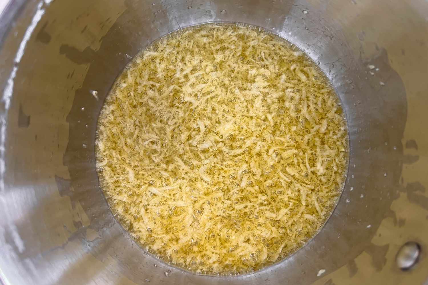 Garlic cooking in a half cup of olive oil