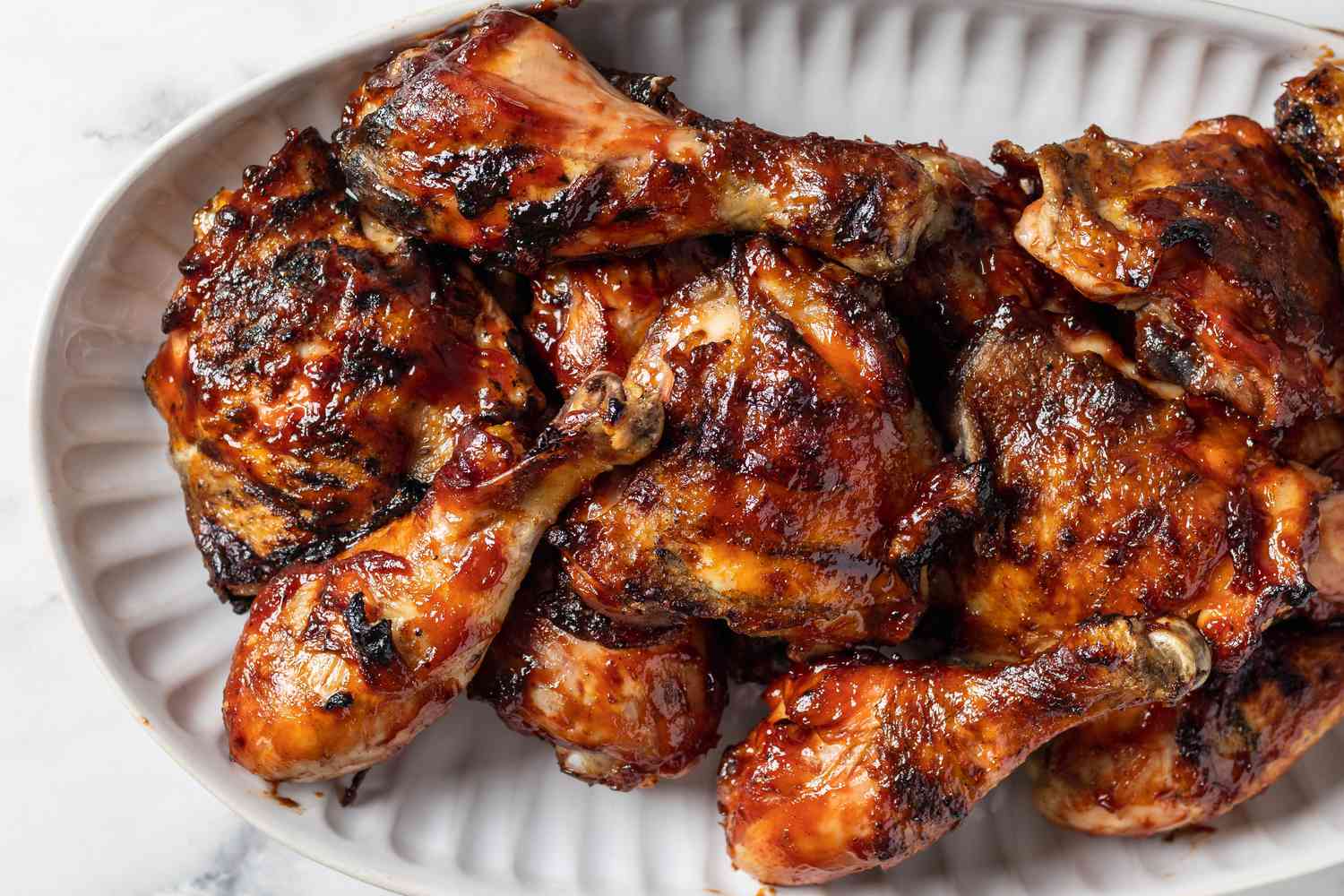 Overhead view of grilled chicken legs.