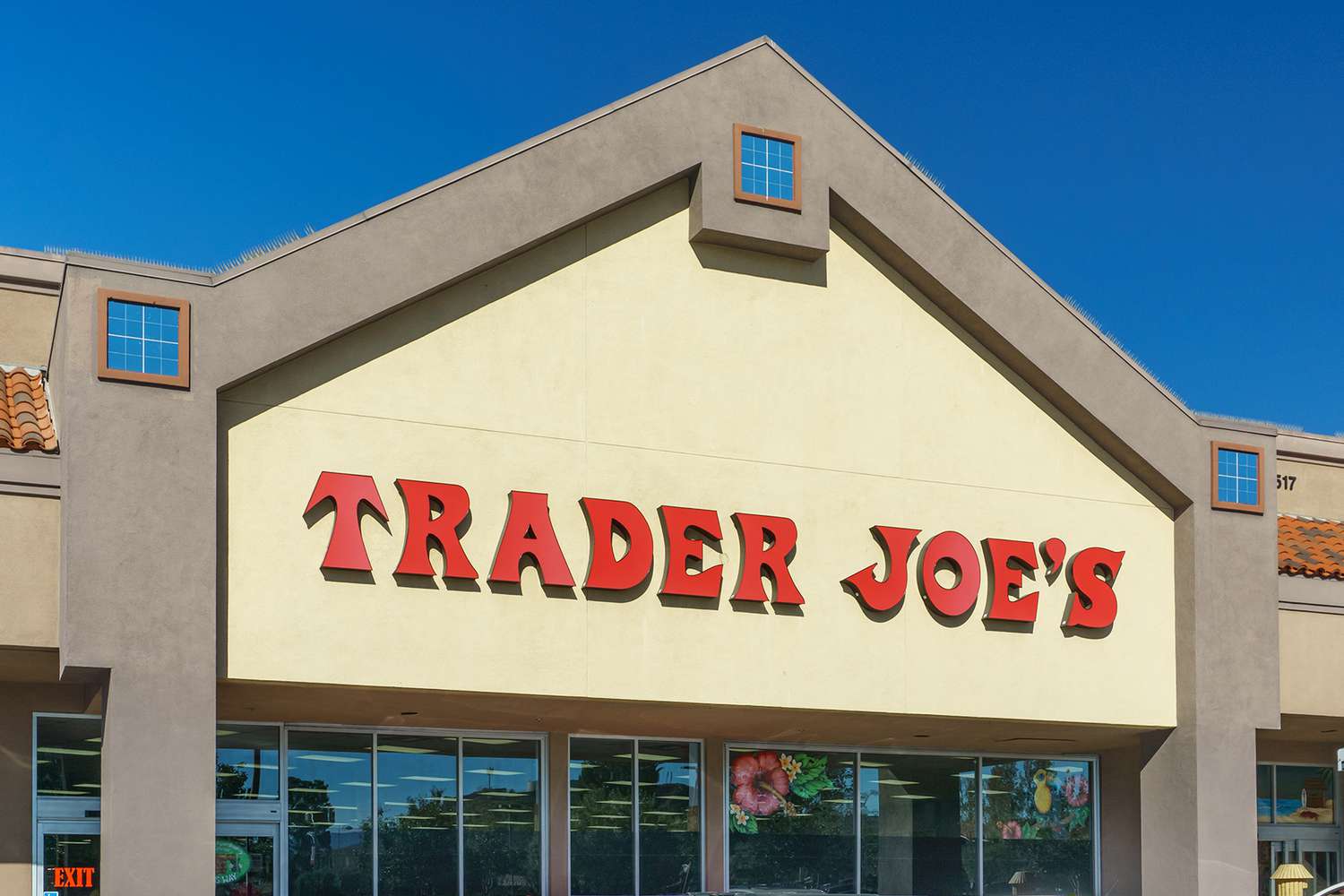 The facade of a Trader Joe's store with a prominent red sign