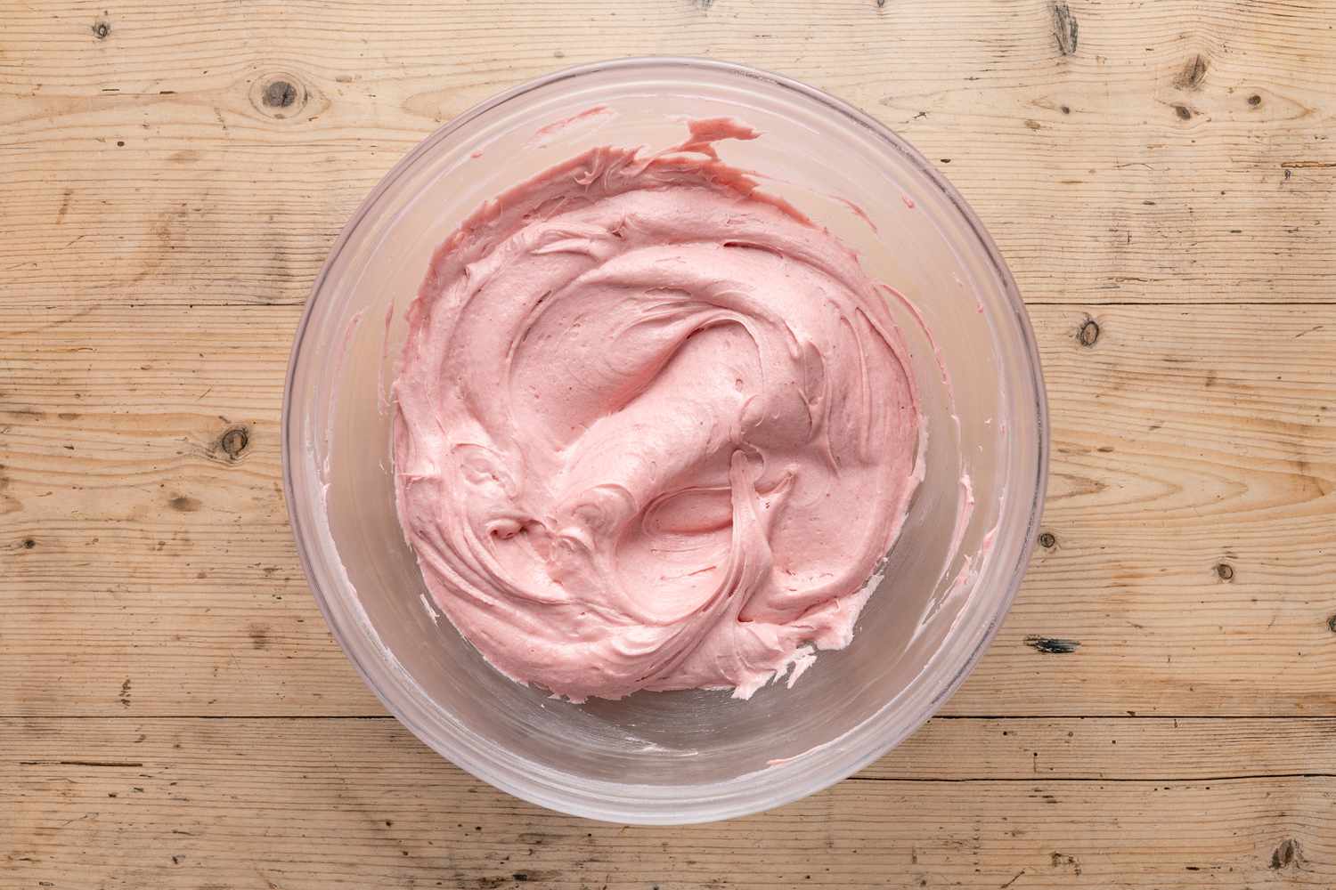 bowl of strawberry icing for strawberry cake recipe
