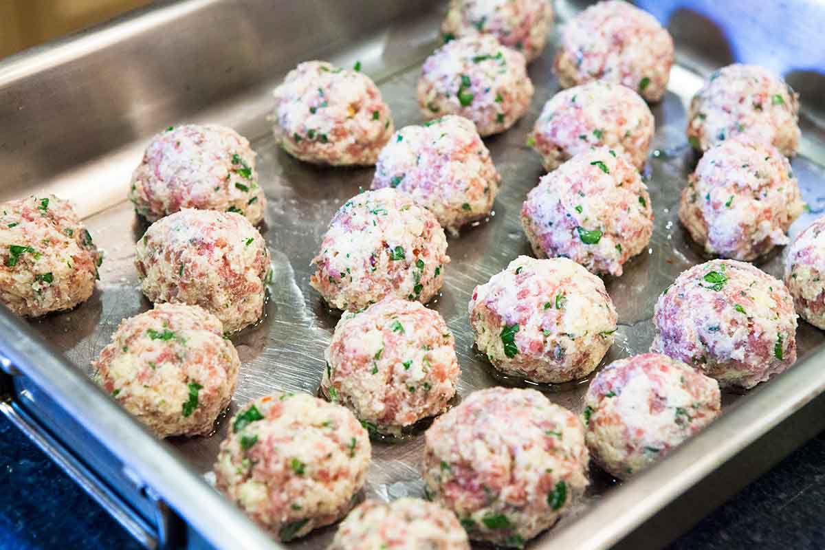 Line up the ricotta meatballs on a baking sheet