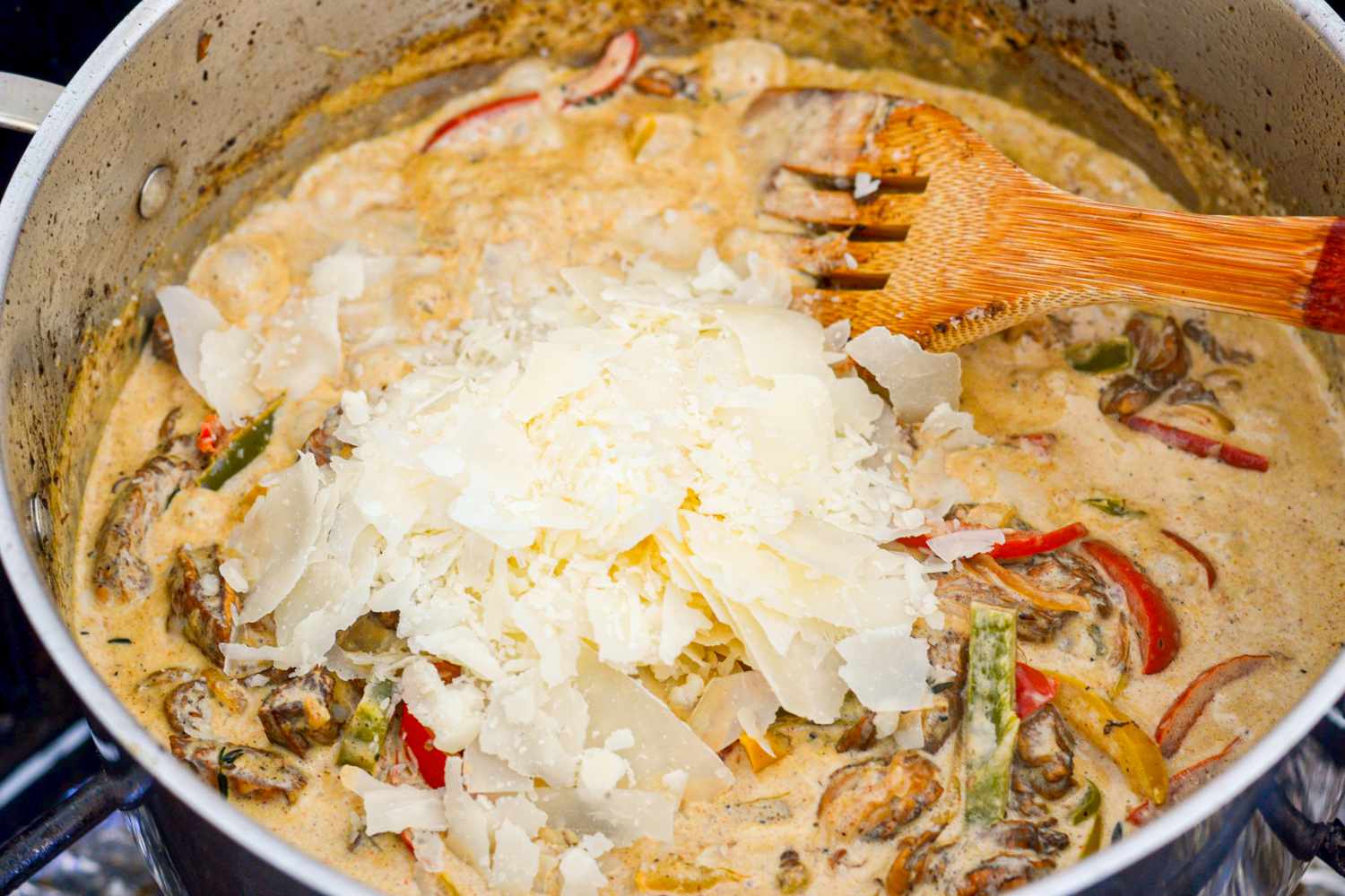 Parmesan Added to Rasta Pasta with Jerk Chicken