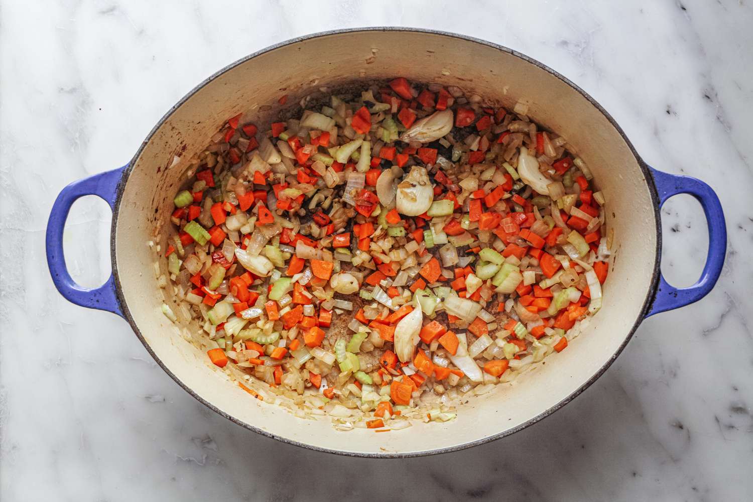 Garlic, Celery, Carrots, and Onion in Dutch Oven for Lamb Shank Stew