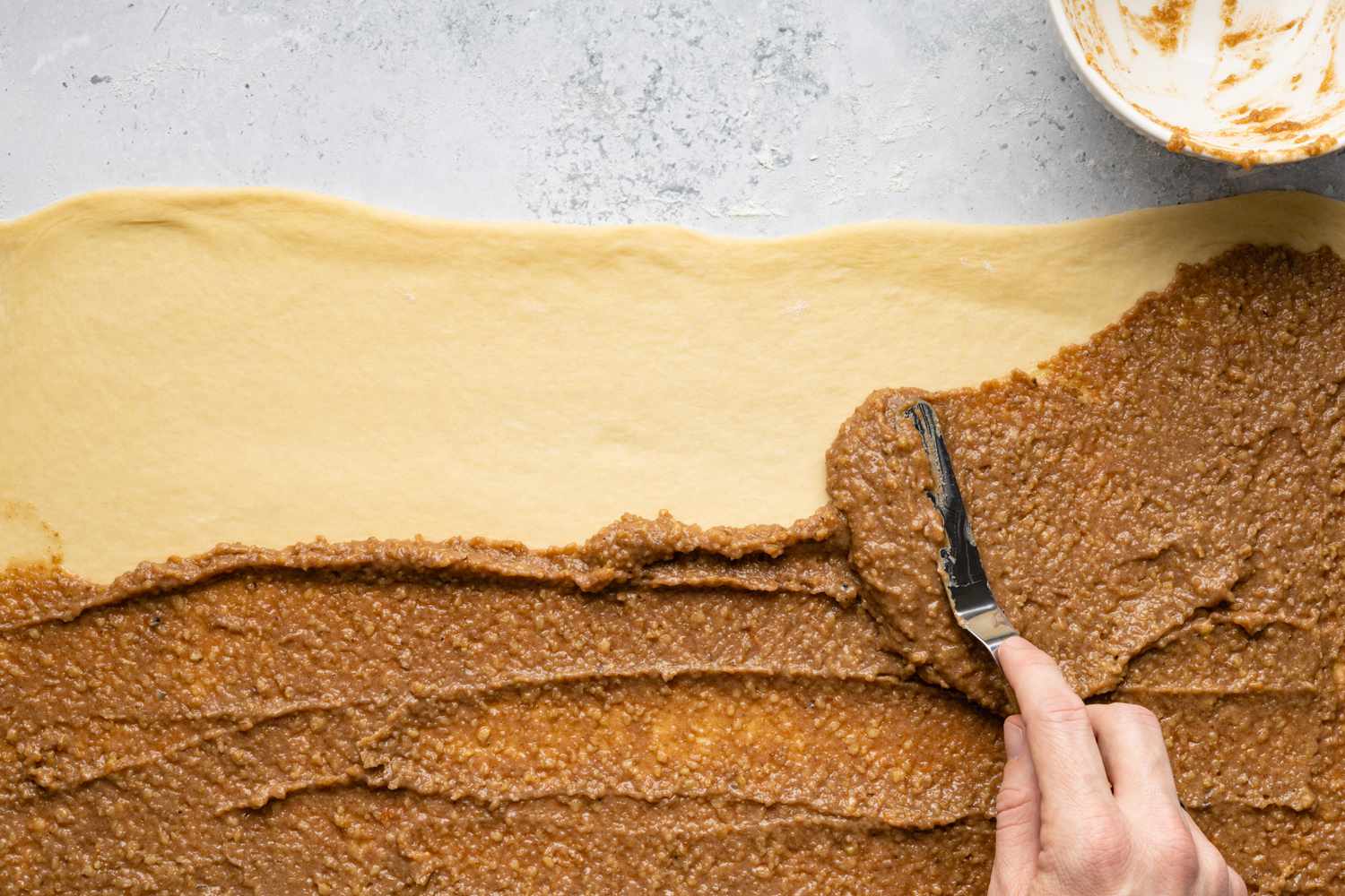 Povitica Filling Slathered onto Dough Using Offset Spatula