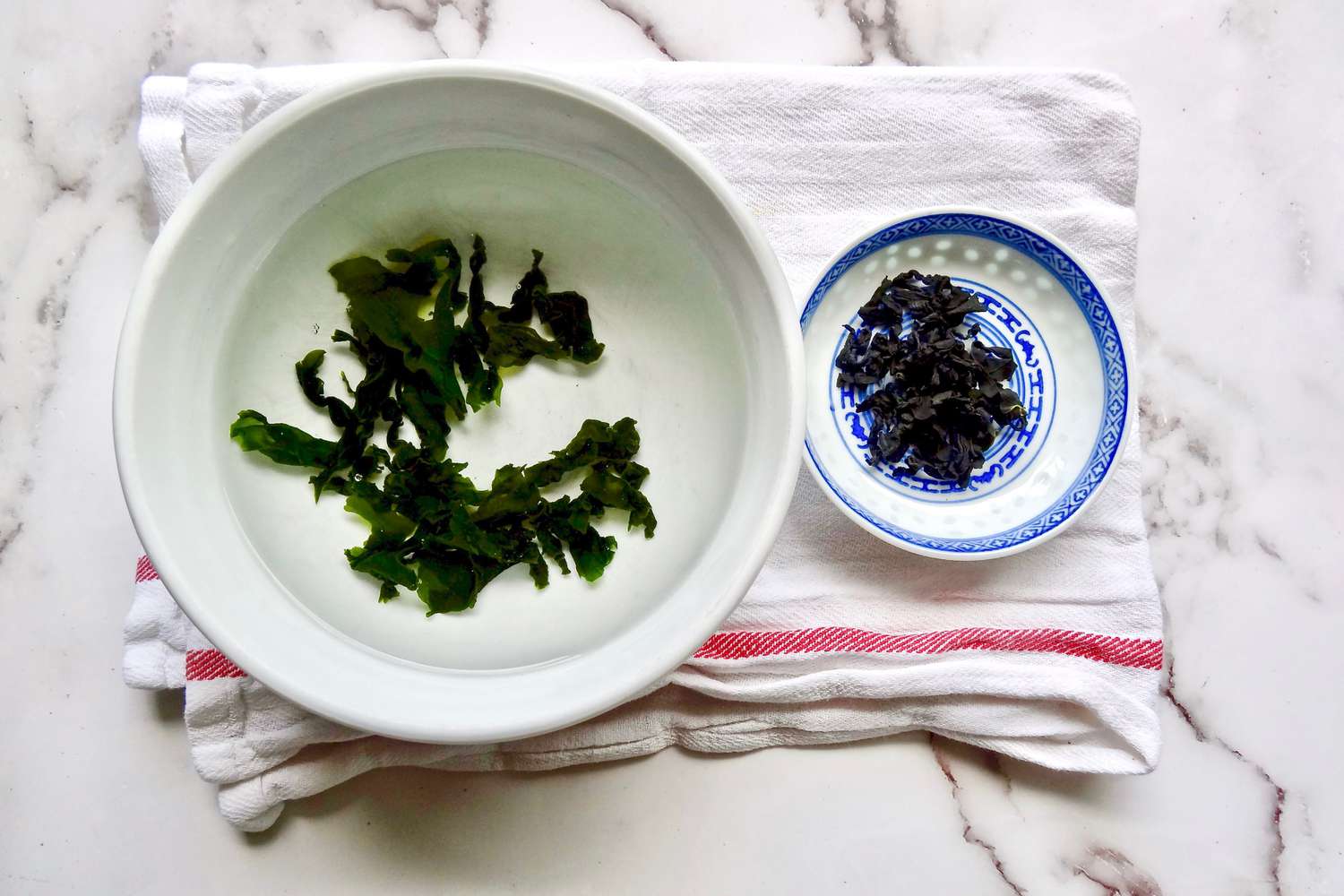 Rehydrating wakame in a bowl to make homemade miso soup.
