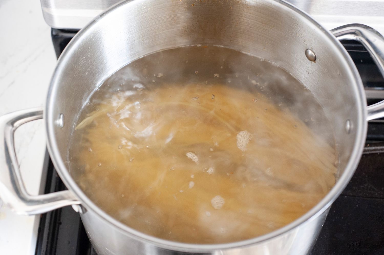 Pot of Pasta in Hot Water for Shrimp and Asparagus Pasta Recipe 