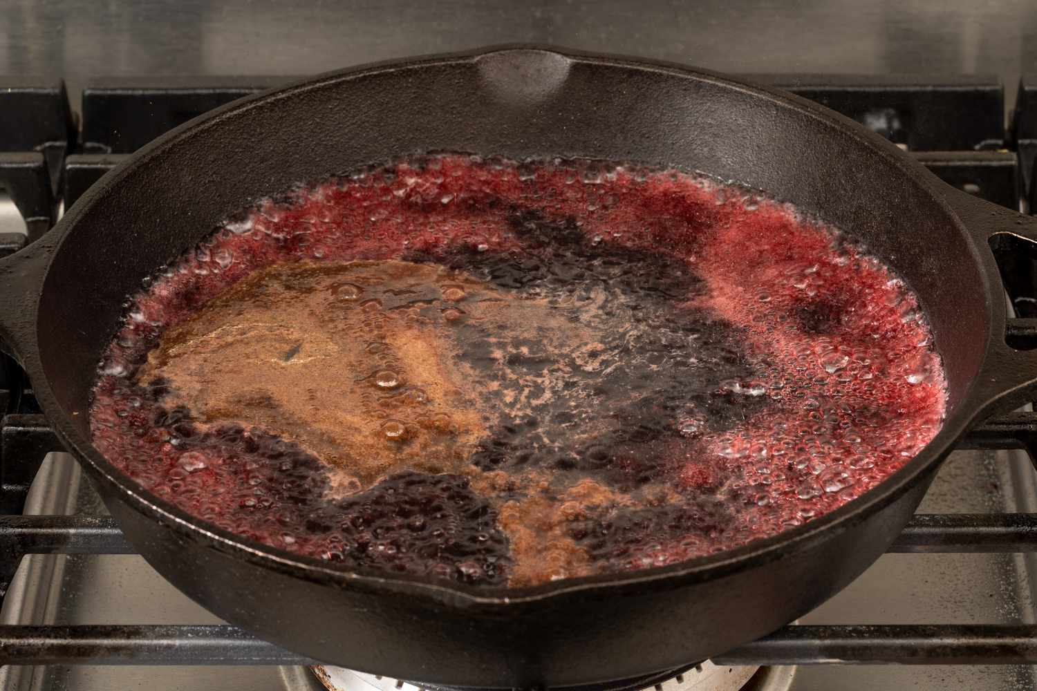 Red wine reducing in a pan