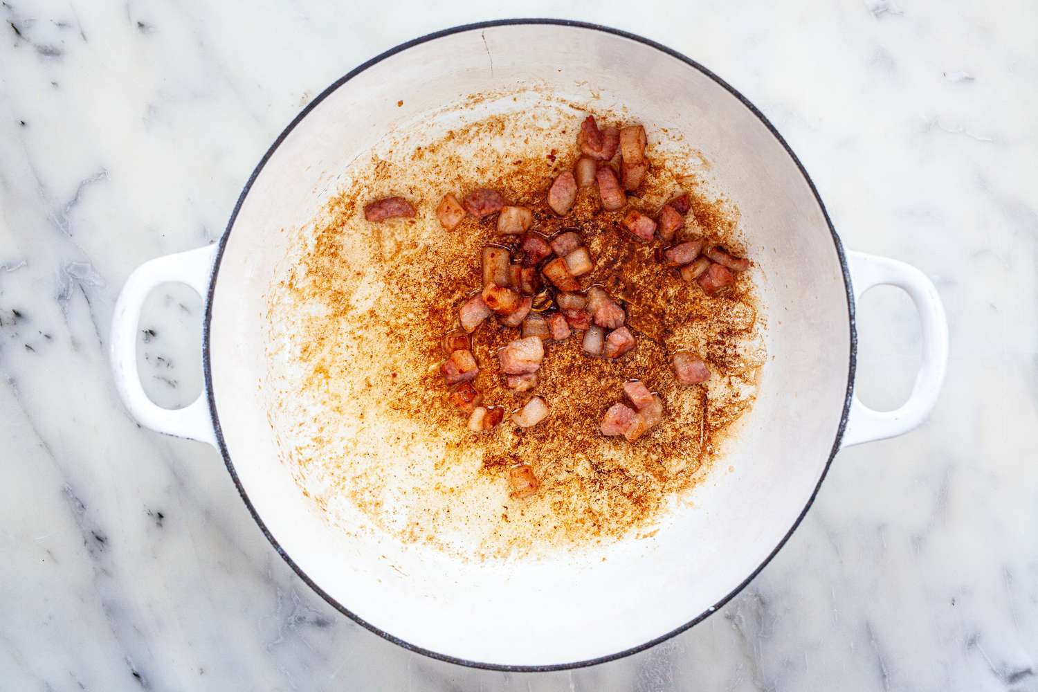 Brown pork in dutch oven for classic tomato sauce