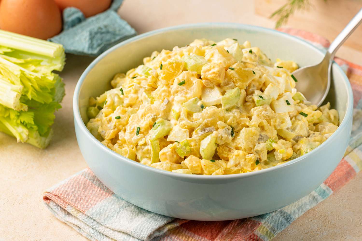 egg salad in a bowl with a spoon